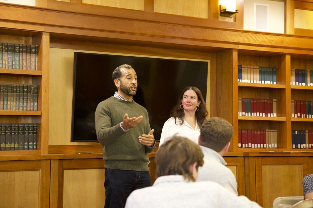 Ian Cain giving a guest lecture in a library